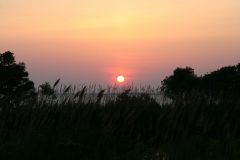 Sunset over the sound across from The Roanoke Island Inn