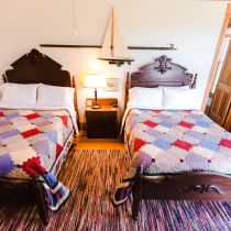 Two Full Beds and Nightstand in Room 2